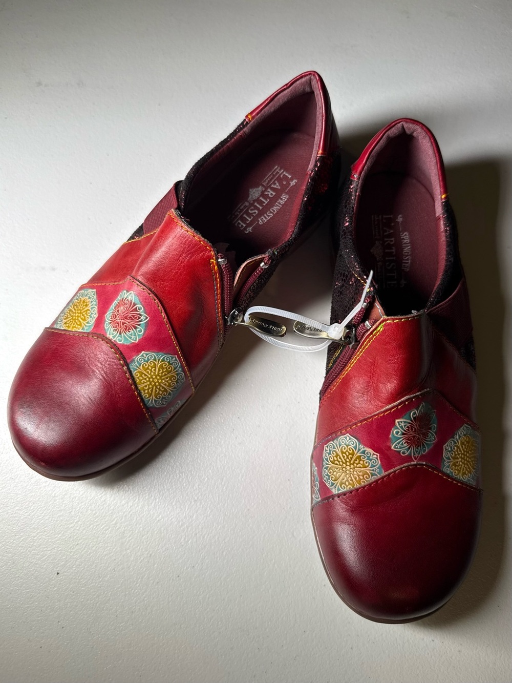 L'ATISTE Women's Cabernet Leather Slip-On Flats with Decorative Medallions 8.5M